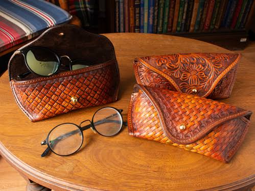A Cross-Textural Conversation: The Tactile Collision of Leather Bags, Tweed Clothing, and Wood-Frame Eyewear