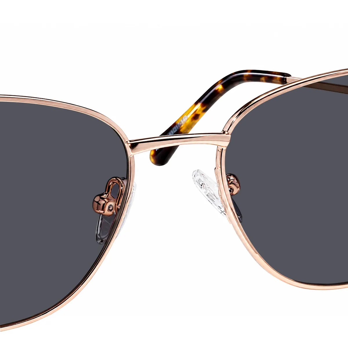 Transparent adjustable nose pads and metal bridge on XCombo Aura gray-lens sunglasses